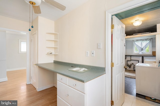 2000 Longview Ct, Baltimore, MD 21237 - kitchen with washer / clothes dryer, a ceiling fan, open shelves, white cabinetry, and light wood-type flooring