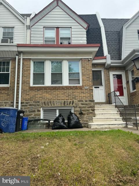 4146 Robbins Ave, Philadelphia, PA 19135 - multi unit property featuring a front yard, brick siding, and a shingled roof