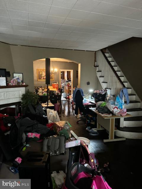 4146 Robbins Ave, Philadelphia, PA 19135 - living area featuring arched walkways and stairway