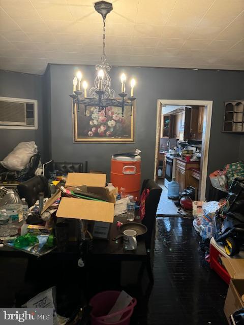 4146 Robbins Ave, Philadelphia, PA 19135 - dining room with a wall unit AC and a chandelier