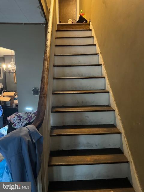 4146 Robbins Ave, Philadelphia, PA 19135 - stairs featuring a chandelier