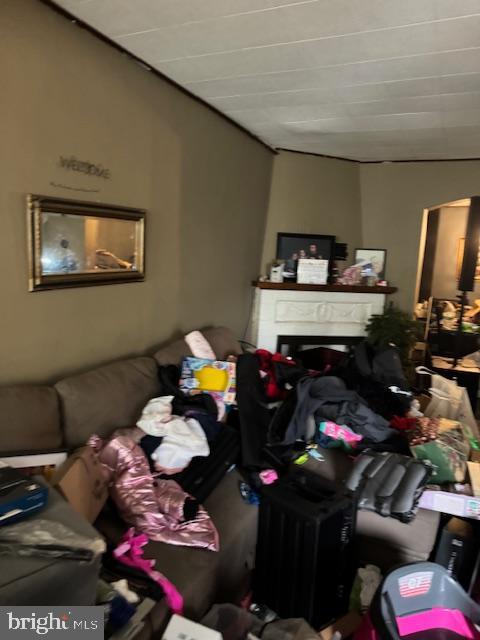 4146 Robbins Ave, Philadelphia, PA 19135 - living room featuring a fireplace