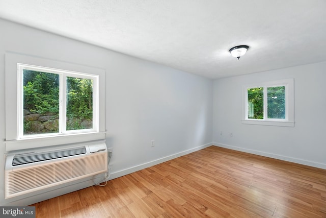 14 Summit Point Dr, Front Royal, VA 22630 - spare room with light wood-style floors and an AC wall unit