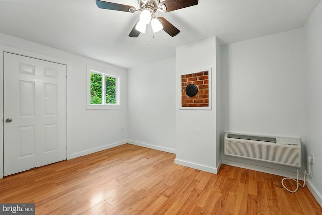 14 Summit Point Dr, Front Royal, VA 22630 - unfurnished bedroom featuring light wood-style floors, a wall mounted AC, and a ceiling fan