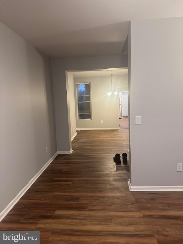 2732 Riggs Ave, Baltimore, MD 21216 - hall with dark wood-style flooring and baseboards