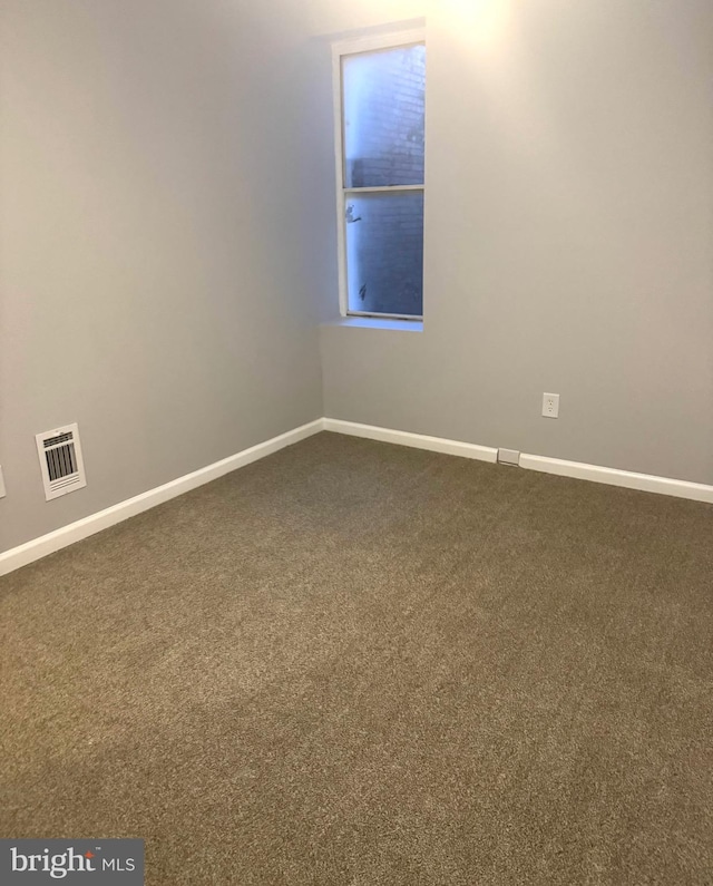 2732 Riggs Ave, Baltimore, MD 21216 - unfurnished room with baseboards and dark colored carpet