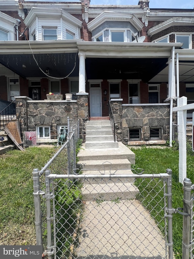 2732 Riggs Ave, Baltimore, MD 21216 - view of front facade featuring a gate and a porch