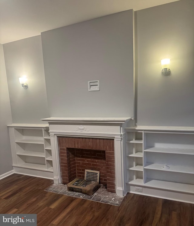 2732 Riggs Ave, Baltimore, MD 21216 - unfurnished living room featuring wood finished floors and a fireplace