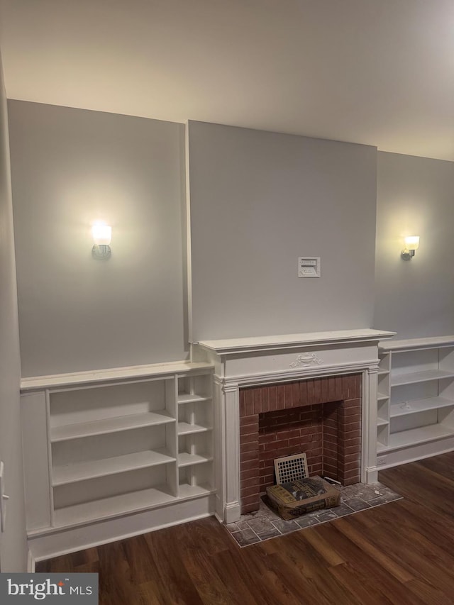 2732 Riggs Ave, Baltimore, MD 21216 - detailed view of wood finished floors and a brick fireplace
