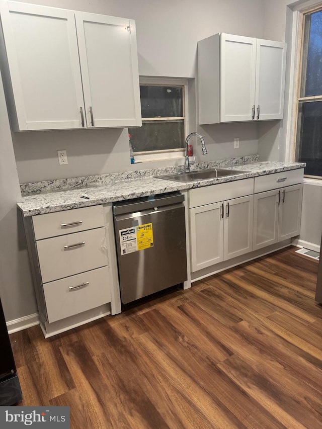 2732 Riggs Ave, Baltimore, MD 21216 - kitchen featuring dishwasher, dark wood-style flooring, and light stone countertops