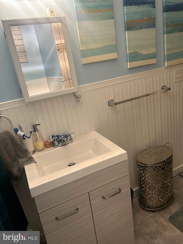 6540 Parnell Ave, Baltimore, MD 21222 - bathroom with vanity, a wainscoted wall, and tile patterned floors