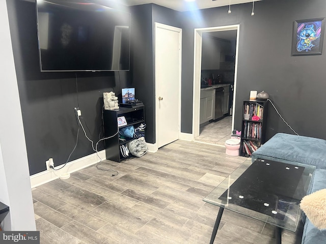 6540 Parnell Ave, Baltimore, MD 21222 - living area featuring light wood-style flooring and baseboards