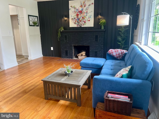 818 W Station Ave, Coopersburg, PA 18036 - living room featuring wood finished floors and a brick fireplace
