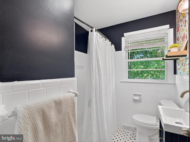 303 Stevens Ave, Reading, PA 19608 - full bath with toilet, vanity, tile walls, and curtained shower