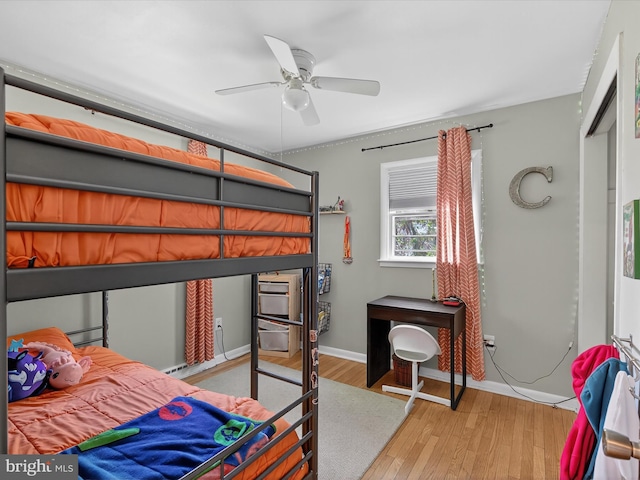 303 Stevens Ave, Reading, PA 19608 - bedroom featuring wood finished floors, a ceiling fan, and baseboards