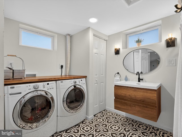 303 Stevens Ave, Reading, PA 19608 - laundry area featuring separate washer and dryer, baseboards, tile patterned floors, and recessed lighting