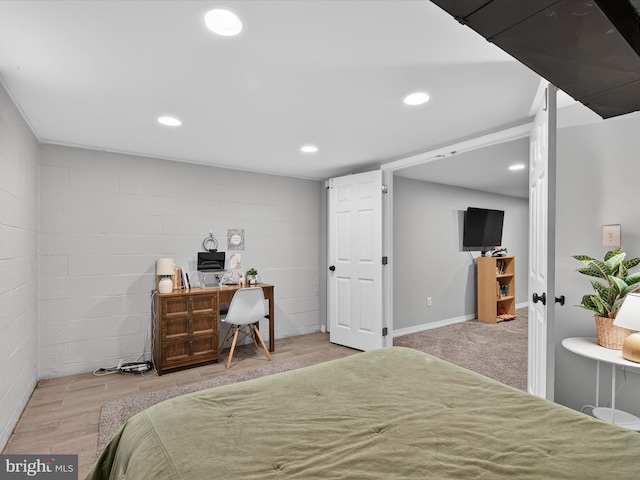303 Stevens Ave, Reading, PA 19608 - bedroom with an office area, recessed lighting, wood finished floors, and concrete block wall
