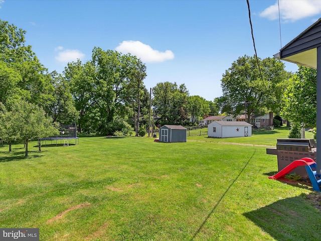 303 Stevens Ave, Reading, PA 19608 - view of grassy yard with a trampoline and view of scattered trees