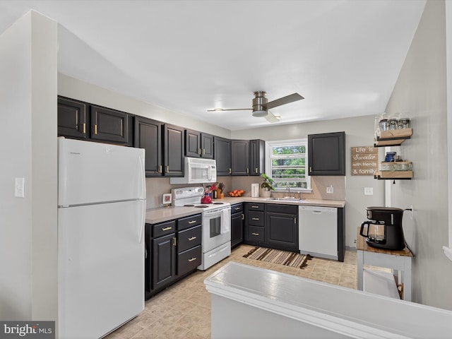 303 Stevens Ave, Reading, PA 19608 - kitchen featuring white appliances, a ceiling fan, light countertops, and a sink
