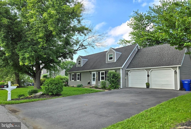 17 Goldenrod Dr, Carlisle, PA 17015 - cape cod home with an attached garage, driveway, a front lawn, and roof with shingles