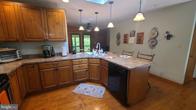 1725 Loop Rd, Franklin, WV 26807 - kitchen featuring black appliances, a sink, a peninsula, brown cabinets, and recessed lighting