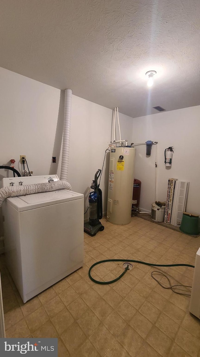 1725 Loop Rd, Franklin, WV 26807 - laundry room with washer / dryer, electric water heater, a textured ceiling, and light flooring