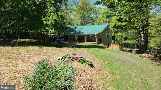 1725 Loop Rd, Franklin, WV 26807 - view of green lawn featuring dirt driveway and a porch