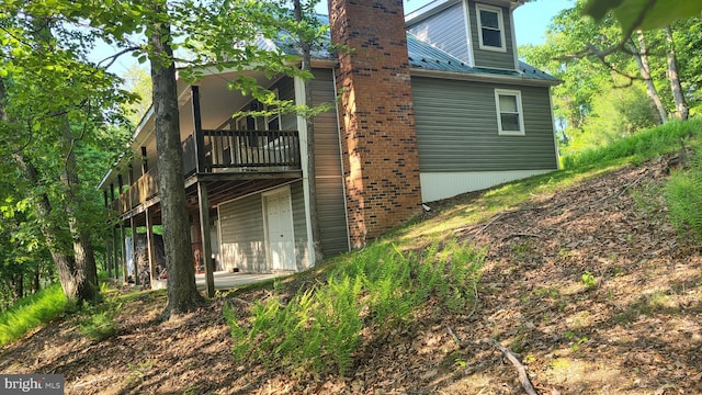1725 Loop Rd, Franklin, WV 26807 - rear view of house with a wooden deck and a chimney