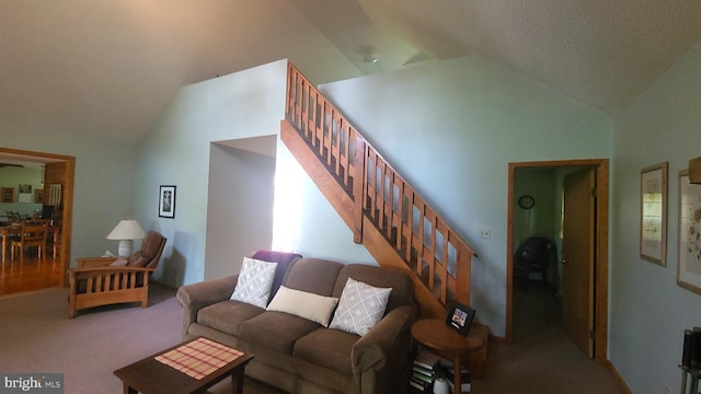 1725 Loop Rd, Franklin, WV 26807 - carpeted living area featuring vaulted ceiling and stairs