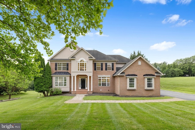 5204 Muirfield Dr, Ijamsville, MD 21754 - view of front of house with a front yard and brick siding