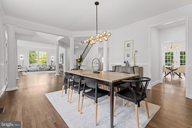 5204 Muirfield Dr, Ijamsville, MD 21754 - dining room featuring decorative columns, a chandelier, dark wood finished floors, ornamental molding, and baseboards