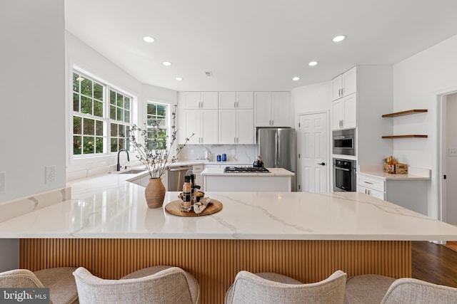5204 Muirfield Dr, Ijamsville, MD 21754 - kitchen with stainless steel appliances, a peninsula, recessed lighting, white cabinetry, and a sink