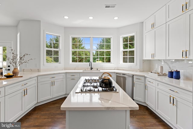 5204 Muirfield Dr, Ijamsville, MD 21754 - kitchen featuring dishwasher, gas cooktop, a center island, recessed lighting, and white cabinetry