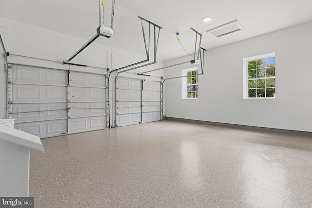 5204 Muirfield Dr, Ijamsville, MD 21754 - garage featuring a garage door opener and baseboards