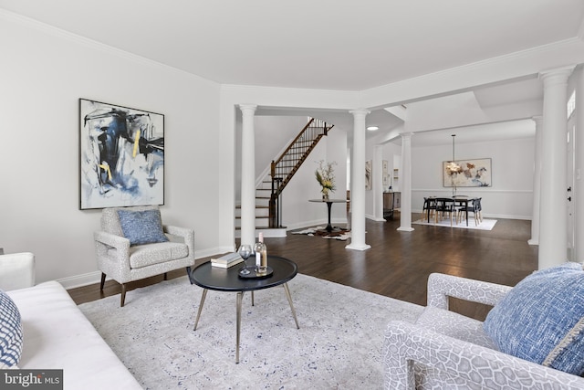 5204 Muirfield Dr, Ijamsville, MD 21754 - living area featuring ornate columns, wood finished floors, baseboards, ornamental molding, and stairway
