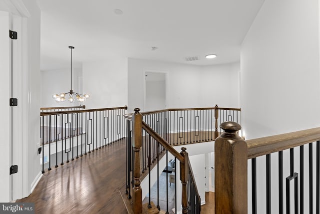 5204 Muirfield Dr, Ijamsville, MD 21754 - hallway featuring a chandelier, wood finished floors, and an upstairs landing