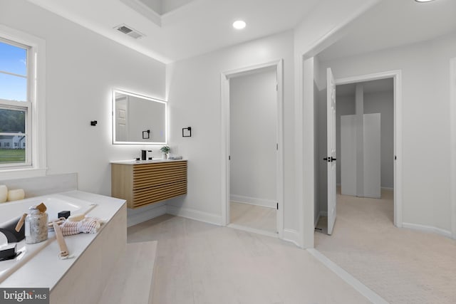 5204 Muirfield Dr, Ijamsville, MD 21754 - bathroom featuring vanity, a garden tub, recessed lighting, and baseboards