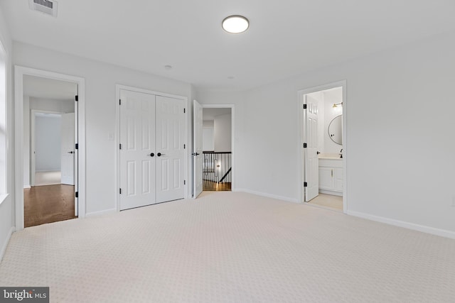 5204 Muirfield Dr, Ijamsville, MD 21754 - unfurnished bedroom featuring carpet, a closet, and baseboards