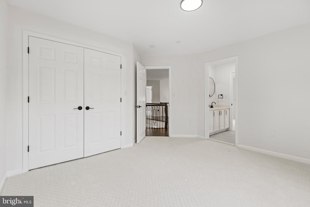 5204 Muirfield Dr, Ijamsville, MD 21754 - unfurnished bedroom with light colored carpet, a closet, and a sink