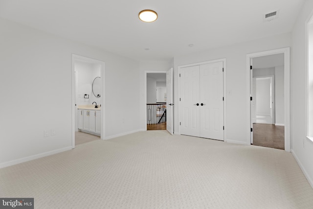 5204 Muirfield Dr, Ijamsville, MD 21754 - unfurnished bedroom with light colored carpet, a closet, baseboards, and ensuite bathroom