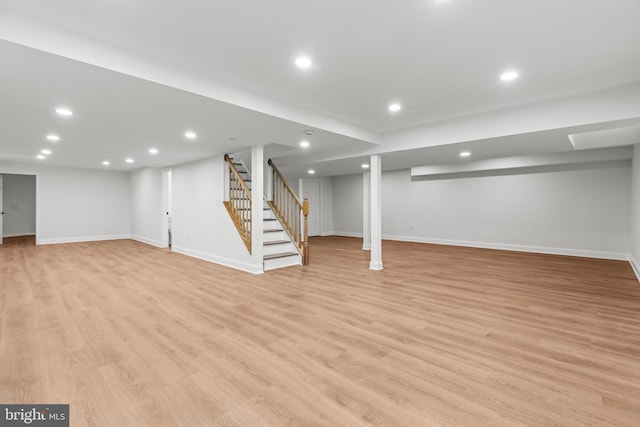 5204 Muirfield Dr, Ijamsville, MD 21754 - finished below grade area with light wood-style flooring, stairs, baseboards, and recessed lighting