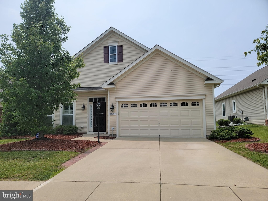11257 Yellowstone Ct, White Plains, MD 20695 - traditional-style house featuring concrete driveway
