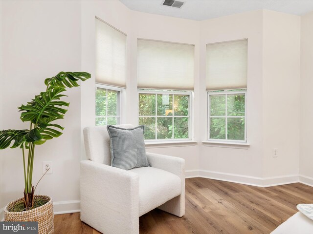 621 Admiral Dr Unit 207, Annapolis, MD 21401 - sitting room with baseboards and wood finished floors