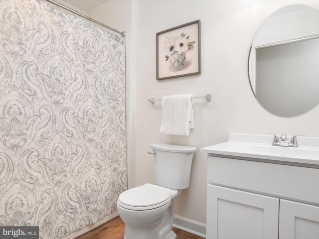 621 Admiral Dr Unit 207, Annapolis, MD 21401 - full bathroom featuring vanity, toilet, wood finished floors, and curtained shower