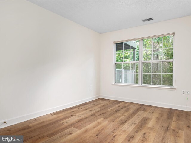 621 Admiral Dr Unit 207, Annapolis, MD 21401 - spare room with baseboards and wood finished floors