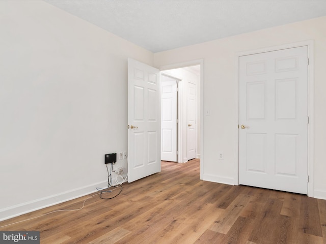 621 Admiral Dr Unit 207, Annapolis, MD 21401 - unfurnished bedroom with baseboards and wood finished floors