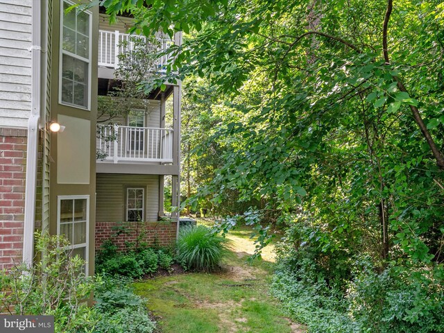 621 Admiral Dr Unit 207, Annapolis, MD 21401 - view of yard featuring a balcony