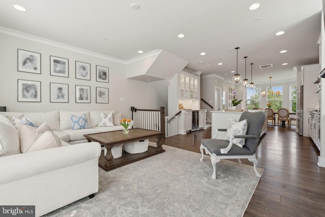 13126 Hawkeye Aly, Clarksburg, MD 20871 - living area with ornamental molding, recessed lighting, dark wood-style floors, and a chandelier
