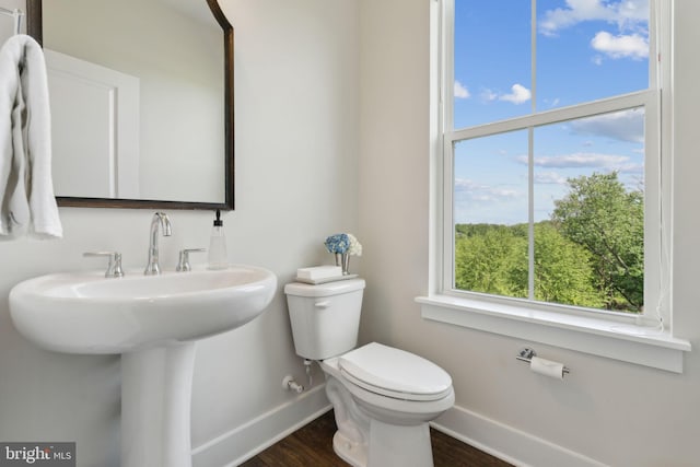 13126 Hawkeye Aly, Clarksburg, MD 20871 - half bathroom featuring baseboards, toilet, healthy amount of natural light, and wood finished floors