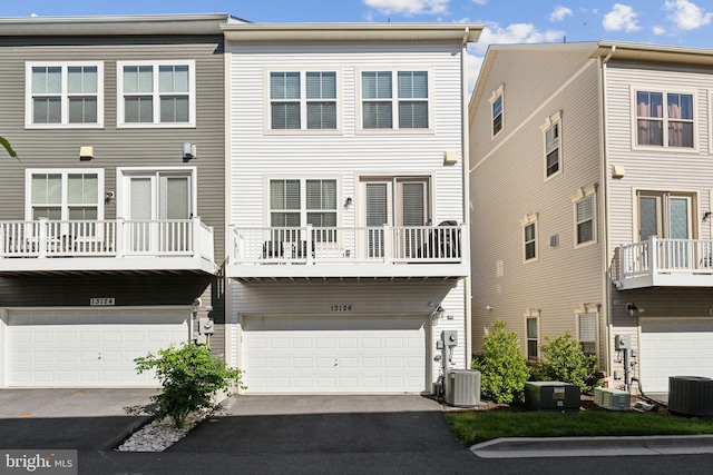 13126 Hawkeye Aly, Clarksburg, MD 20871 - back of property featuring cooling unit, a garage, and asphalt driveway